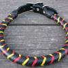 black with red and yellow braid over a rolled collar